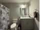 Practical bathroom with a vanity, toilet, and shower-tub, designed for everyday convenience at 3456 Village Glen Ct, Snellville, GA 30039