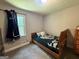 Small bedroom featuring carpet, a twin bed, and a single window at 3456 Village Glen Ct, Snellville, GA 30039