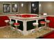 This wet bar features a red and white color scheme and seating for six at 315 Westbourne Dr, Tyrone, GA 30290