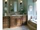 The marble topped vanity and soft green walls add to the ambiance of this bathroom at 315 Westbourne Dr, Tyrone, GA 30290