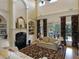 Elegant living room featuring a fireplace, built-in shelving, and a large glass sliding door at 315 Westbourne Dr, Tyrone, GA 30290