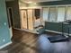 A large bathroom features a glass shower, laminate flooring, and a window bench at 205 Aberdeen Dr, Peachtree City, GA 30269