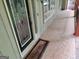 Close up view of the covered front porch entry with stained glass side windows at 205 Aberdeen Dr, Peachtree City, GA 30269