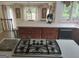 Modern kitchen featuring stainless steel appliances, white countertops, and wood cabinetry at 205 Aberdeen Dr, Peachtree City, GA 30269