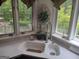 Farmhouse kitchen sink with stainless steel faucet, lovely view of yard and plenty of natural light at 205 Aberdeen Dr, Peachtree City, GA 30269
