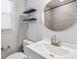 Bathroom featuring a white vanity, sink, and mirror with a view of the tiled shower at 1599 Ezra Church Nw Dr, Atlanta, GA 30314