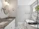 Well-lit bathroom with double granite sinks, a soaking tub, and a separate shower at 1599 Ezra Church Nw Dr, Atlanta, GA 30314