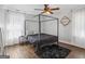 Stylish bedroom featuring a four-poster bed frame, hardwood flooring, and modern decor at 1599 Ezra Church Nw Dr, Atlanta, GA 30314