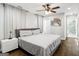 The main bedroom has hardwood floors, a bed, and a white and gray color scheme at 1599 Ezra Church Nw Dr, Atlanta, GA 30314
