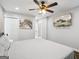 A spacious bedroom featuring a ceiling fan, stylish decor, and a mounted television at 1599 Ezra Church Nw Dr, Atlanta, GA 30314