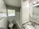 Bathroom with white tiled shower and tub, granite countertops, and an updated mirror at 1417 Lavender Nw Dr, Atlanta, GA 30314