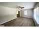 Sun-filled living room with modern floors, a ceiling fan, and fresh paint at 1417 Lavender Nw Dr, Atlanta, GA 30314