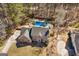 Inviting brick home features a backyard pool nestled within a wooded landscape and a private fenced in yard at 212 Birkhill, Peachtree City, GA 30269