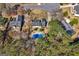Aerial view of a residential neighborhood featuring a brick home with an in-ground pool at 212 Birkhill, Peachtree City, GA 30269
