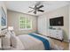 A staged bedroom showcases a double bed, dresser, carpeted floors, and a window at 212 Birkhill, Peachtree City, GA 30269