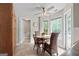 Charming dining area with bright windows, ceiling fan, and access to the backyard at 212 Birkhill, Peachtree City, GA 30269