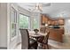 Bright dining area with large windows and views into the kitchen at 212 Birkhill, Peachtree City, GA 30269