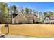 Attractive two-story brick home with a well-maintained lawn and classic mailbox at 212 Birkhill, Peachtree City, GA 30269