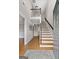 Inviting foyer with wood floors, a staircase, and ample natural light pouring in at 212 Birkhill, Peachtree City, GA 30269