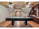 A game room is shown, featuring hardwood floors, built-in cabinetry, and a pool table at 212 Birkhill, Peachtree City, GA 30269