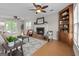 Inviting living room with fireplace, hardwood floors, and ceiling fans at 212 Birkhill, Peachtree City, GA 30269