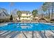 Enjoy your own backyard with this refreshing in-ground pool surrounded by lush landscaping at 212 Birkhill, Peachtree City, GA 30269