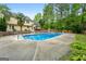 Sparkling pool in a private backyard with lush landscaping and space for lounging at 212 Birkhill, Peachtree City, GA 30269