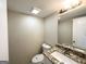 Well-lit half bath features granite countertop vanity at 2717 Knollberry Ln, Decatur, GA 30034