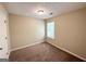 Cozy bedroom features neutral walls, plush carpet, and natural light from the window at 2717 Knollberry Ln, Decatur, GA 30034