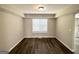 Bright dining room area with wood floors and a large window providing natural light at 2717 Knollberry Ln, Decatur, GA 30034