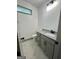 Bathroom featuring granite countertop, tile flooring, and grey vanity at 304 N Dogwood Ave, Social Circle, GA 30025