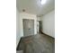 Bedroom with neutral carpet, gray trim, and closet with gray doors at 304 N Dogwood Ave, Social Circle, GA 30025