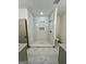 Modern bathroom with elegant white tiled shower and tiled floors at 304 N Dogwood Ave, Social Circle, GA 30025
