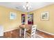 Sunny dining area with hardwood flooring and overhead lighting at 122 Hilo Rd, Fayetteville, GA 30215