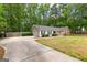 Charming single-story home with a stone facade and well-manicured lawn at 122 Hilo Rd, Fayetteville, GA 30215
