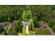 Aerial view of property showcasing the home nestled among lush greenery and a well maintained lawn at 120 Lyndhurst Way, Sharpsburg, GA 30277