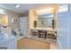 Bright bathroom featuring white vanity, dual mirrors, and unique shower curtain at 120 Lyndhurst Way, Sharpsburg, GA 30277