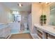 Bright bathroom featuring a vanity with dual sinks and a separate makeup area at 120 Lyndhurst Way, Sharpsburg, GA 30277