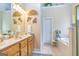 Well-lit bathroom featuring double vanities, a soaking tub, and stylish fixtures at 120 Lyndhurst Way, Sharpsburg, GA 30277