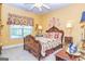 Comfortable bedroom with a decorative bed, warm yellow walls, and plenty of natural light at 120 Lyndhurst Way, Sharpsburg, GA 30277