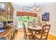 Charming dining area featuring hardwood floors, natural light, and decorative accents at 120 Lyndhurst Way, Sharpsburg, GA 30277