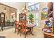 Spacious dining room area featuring a traditional table, large window and access to foyer at 120 Lyndhurst Way, Sharpsburg, GA 30277