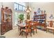 Traditional dining room featuring ample natural light, classic furniture and display cabinets at 120 Lyndhurst Way, Sharpsburg, GA 30277