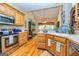 Bright kitchen featuring stainless steel appliances and wood cabinetry with ample counter space at 120 Lyndhurst Way, Sharpsburg, GA 30277
