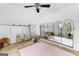 Bright attic space with multiple mirrors, ceiling fan, and plenty of natural light and potential at 195 Blackberry Run, Fayetteville, GA 30214
