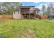 Home's back exterior with large deck and screened in back porch at 195 Blackberry Run, Fayetteville, GA 30214