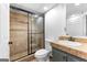 Bathroom featuring a tiled walk-in shower, tiled vanity, and tiled flooring at 195 Blackberry Run, Fayetteville, GA 30214