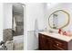 Bathroom featuring a modern vanity, stone floor tiles, tub and shower with tile surround at 195 Blackberry Run, Fayetteville, GA 30214