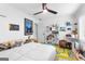 Bedroom with a ceiling fan, a bed and bright window with lots of decor at 195 Blackberry Run, Fayetteville, GA 30214