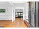 Open foyer with gleaming hardwood floors and a view into the living room at 195 Blackberry Run, Fayetteville, GA 30214